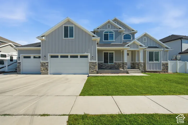 Light grey siding exterior with stone accents