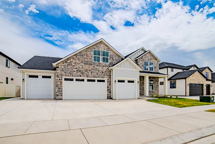 Stone and siding exterior with multiple gables
