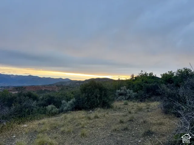 Expansive mountain landscape featuring varied terrain and natural foliage