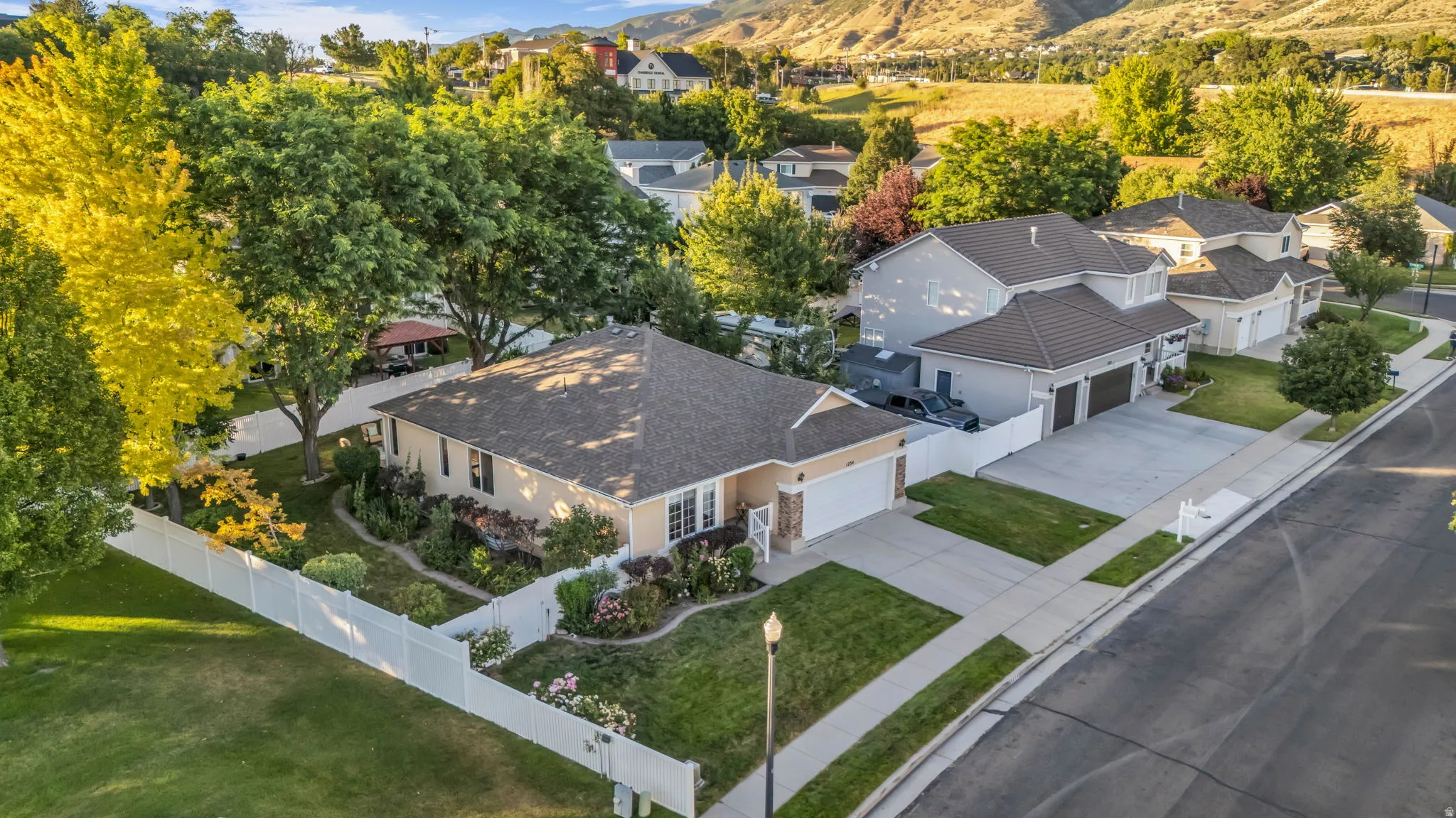 Single-story residence featuring a neutral exterior, a shingle roof, and an attached two-car garage