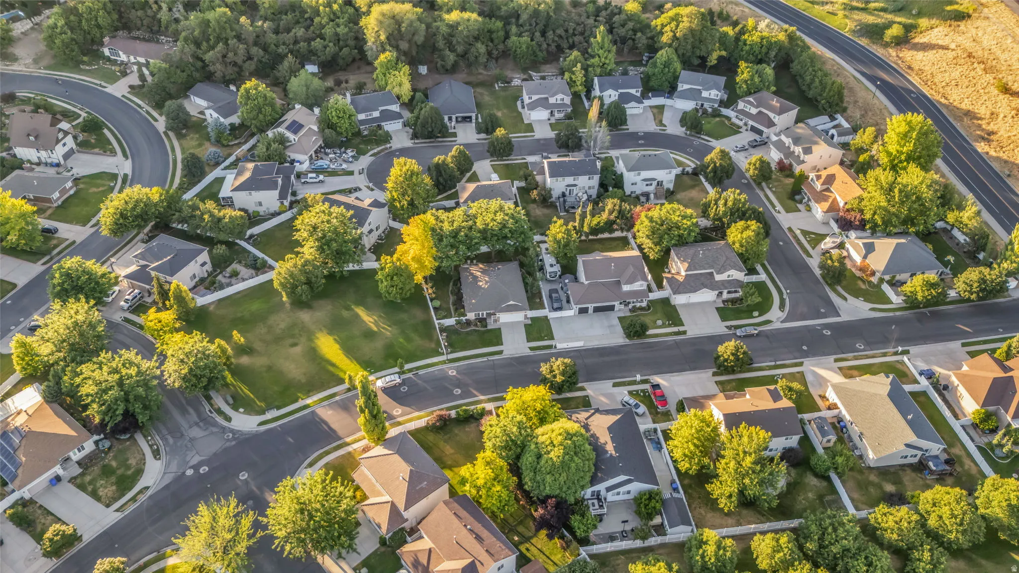Residential neighborhood featuring varied single-family homes and mature trees