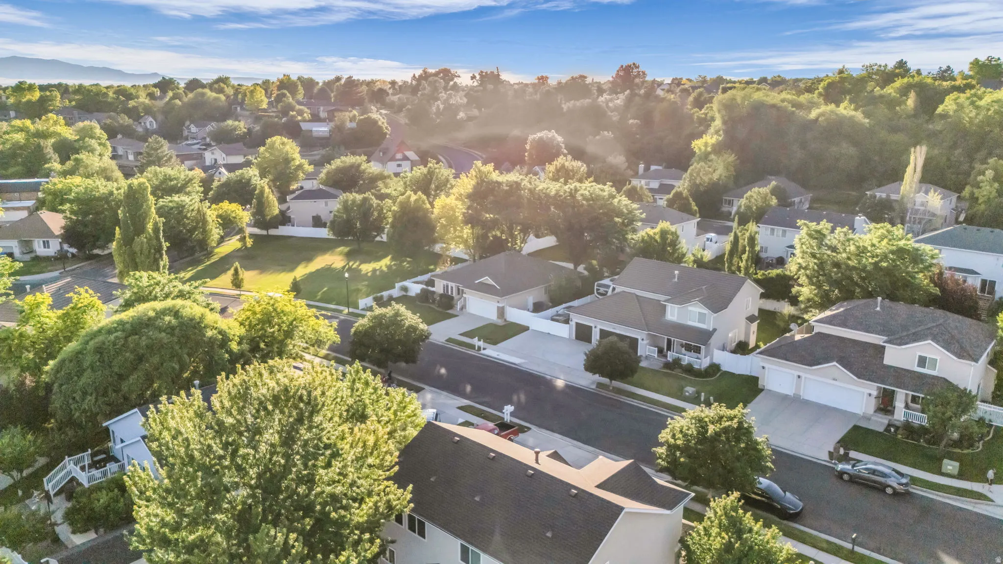 Aerial perspective showcasing a residential street with multiple properties