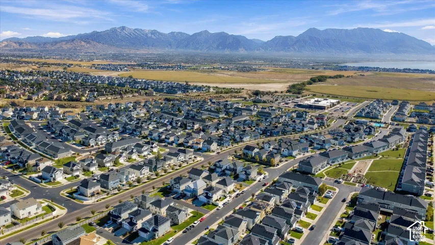 Expansive residential development featuring a diverse range of homes, structured street layouts, and open green spaces