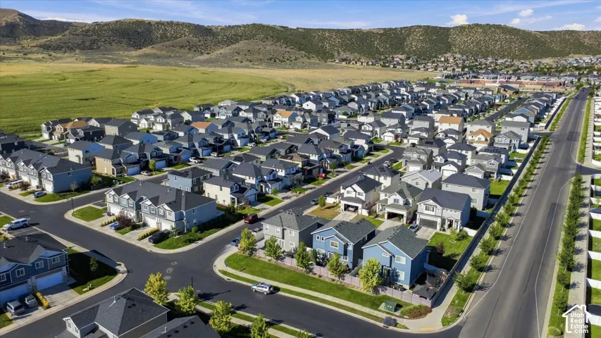 Established residential community with varied architectural styles, paved roadways, and landscaped green spaces