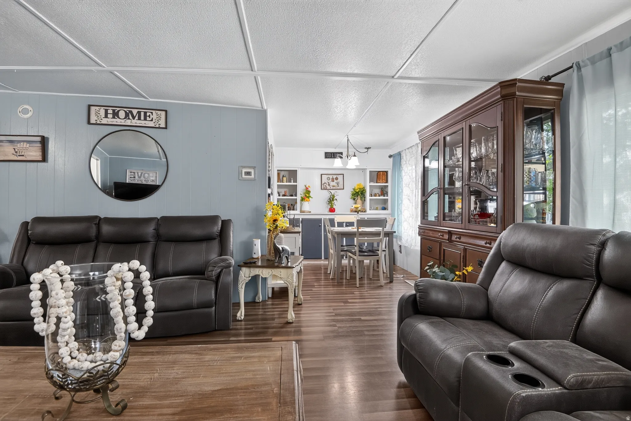 Open-concept living area with wood-finish flooring