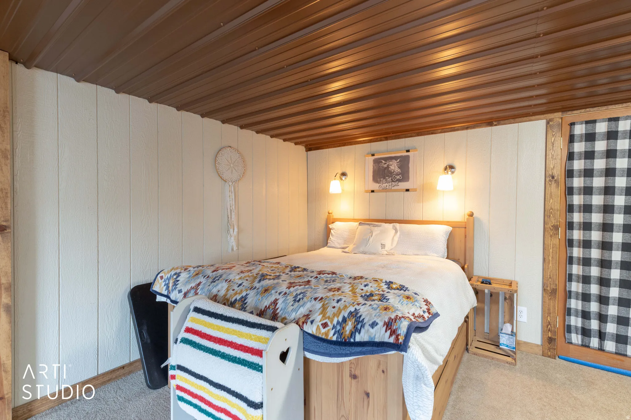Corrugated metal ceiling paired with vertical shiplap walls