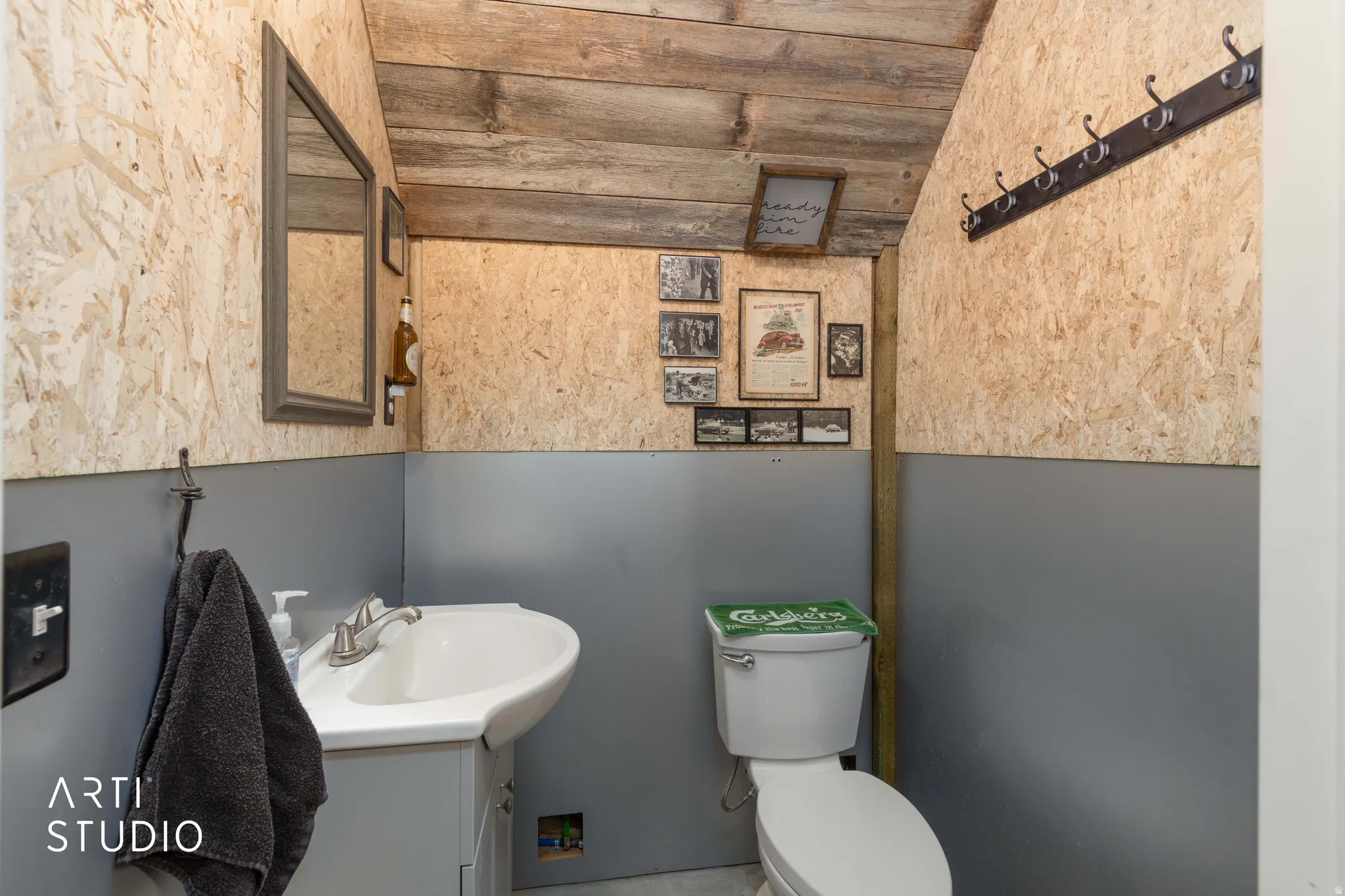 Functional washroom with a pedestal sink and coordinating vanity
