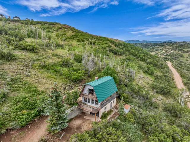 Mountain rustic cabin presenting an excellent opportunity for buyers seeking value and potential.