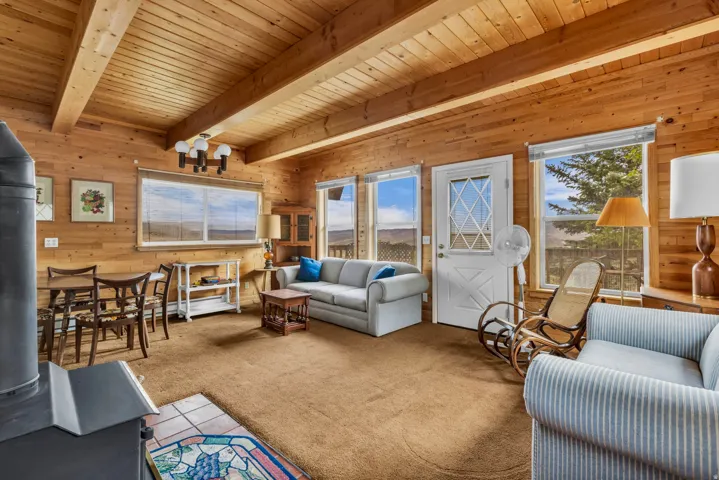 Exposed wood beams and open floor plan.