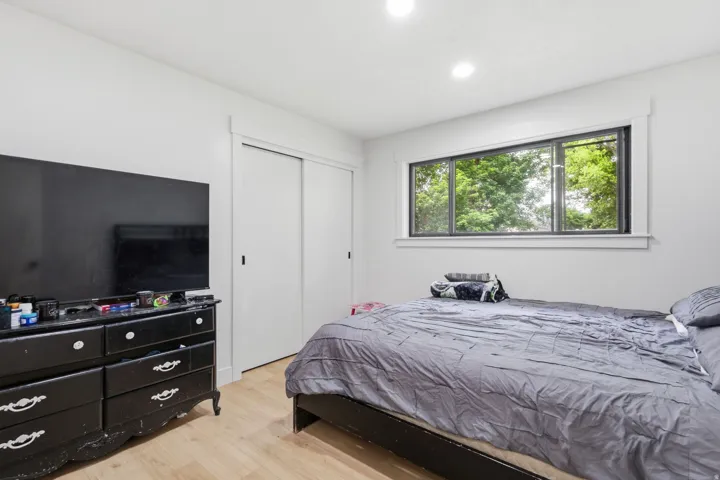 Room featuring light wood-finish flooring and white walls
