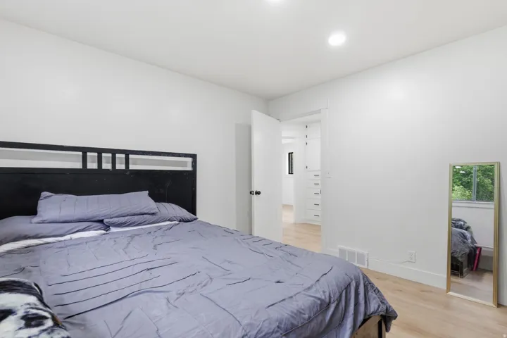 Bedroom featuring light wood-finish flooring and white walls