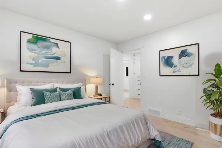 Bedroom featuring light wood-finish flooring, recessed lighting, and a neutral color palette
