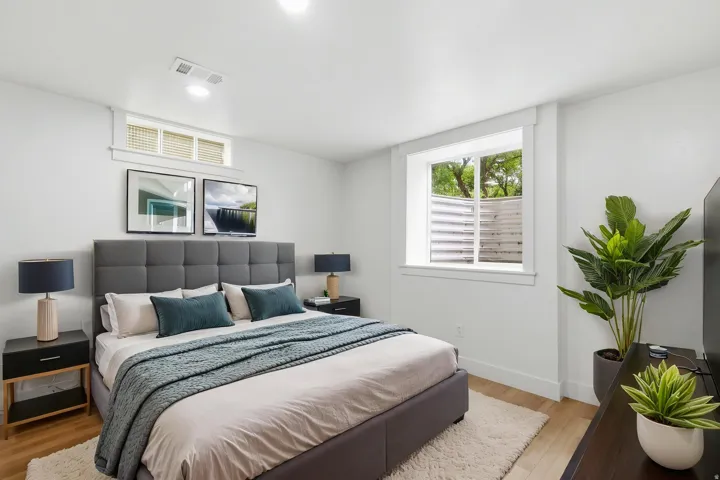 Light-filled room featuring recessed lighting, light wood-finish flooring, and white baseboards
