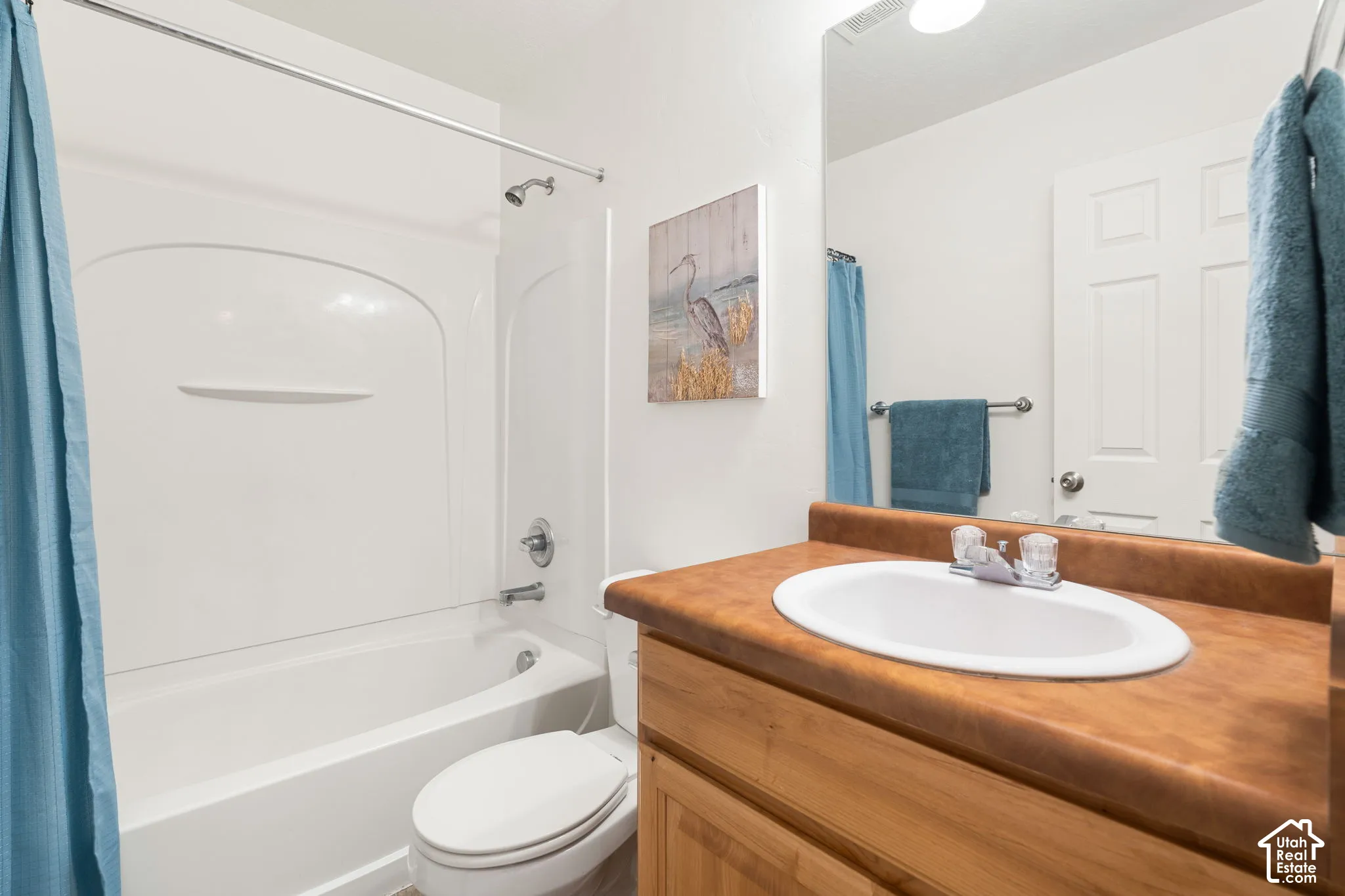 Full bathroom featuring a white tub and shower combination