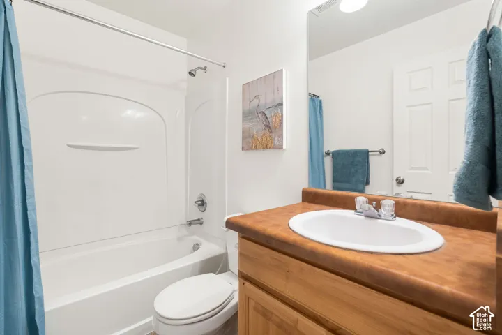Full bathroom featuring a white tub and shower combination