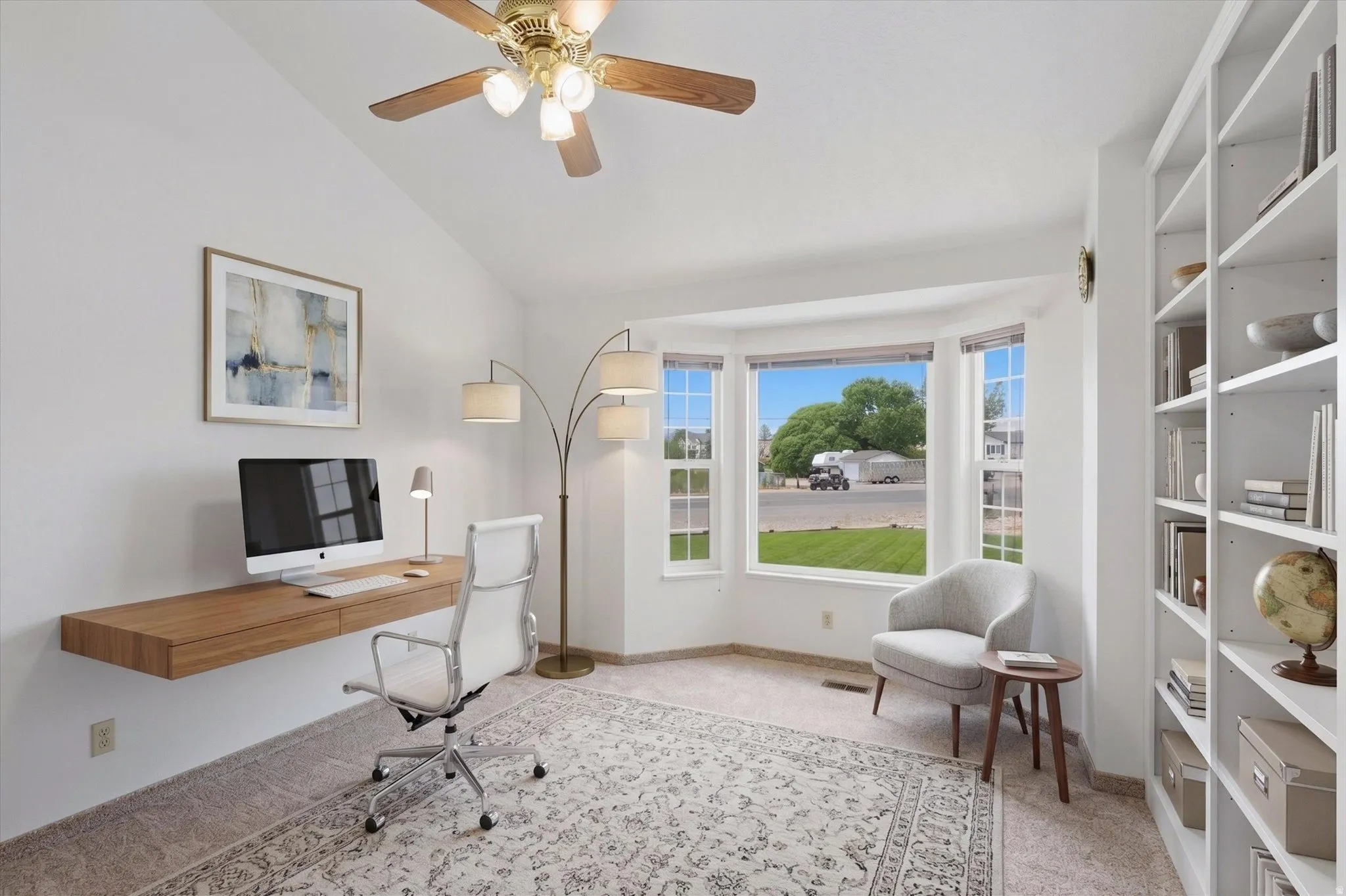 Vaulted ceiling with a ceiling fan