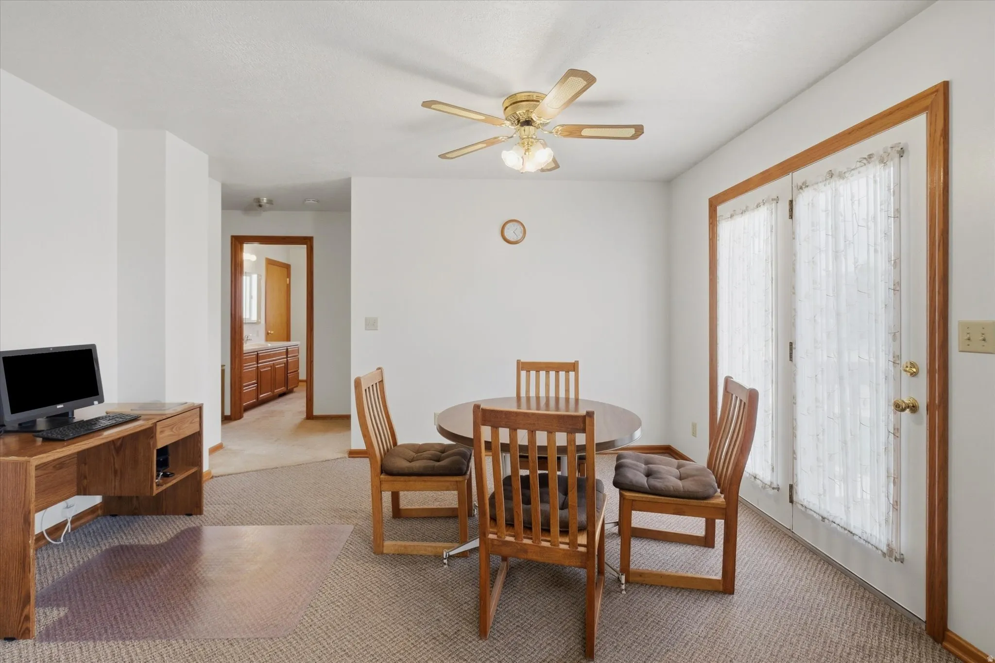 Dining area with overhead ceiling fan lighting and French doors