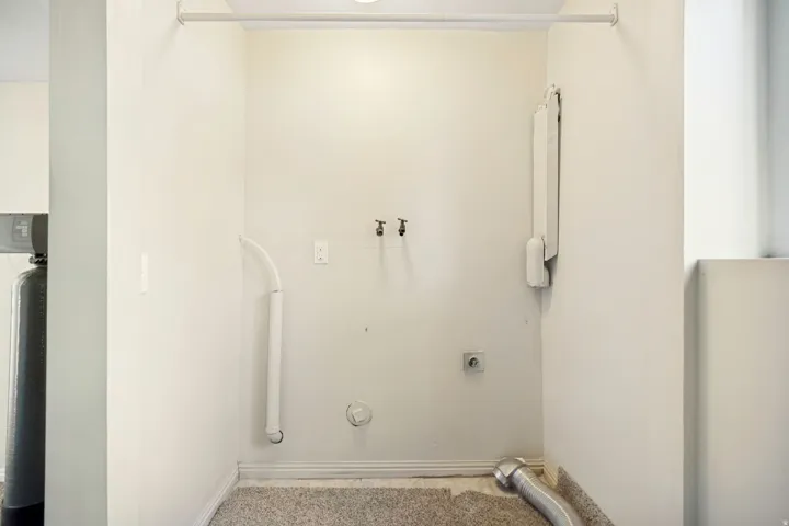 Dedicated laundry area featuring a water hookup, electrical outlet, and vent for appliances