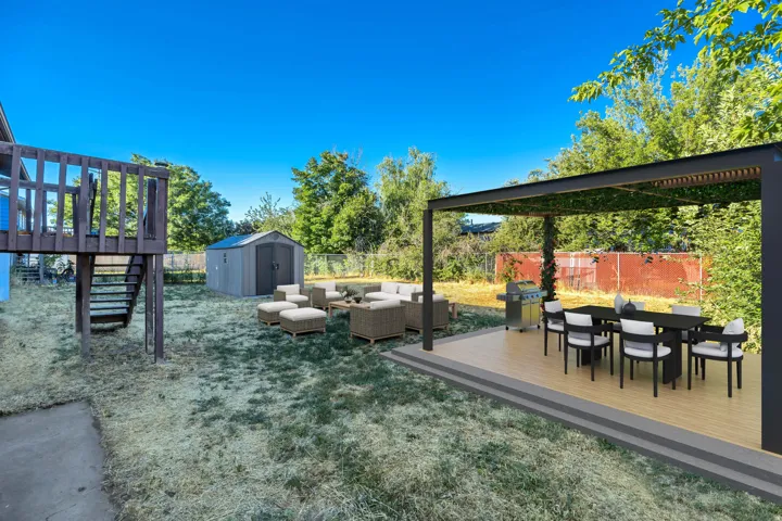 Virtually staged Expansive backyard featuring a multi-level wooden deck, a dedicated storage shed, and a paved patio area