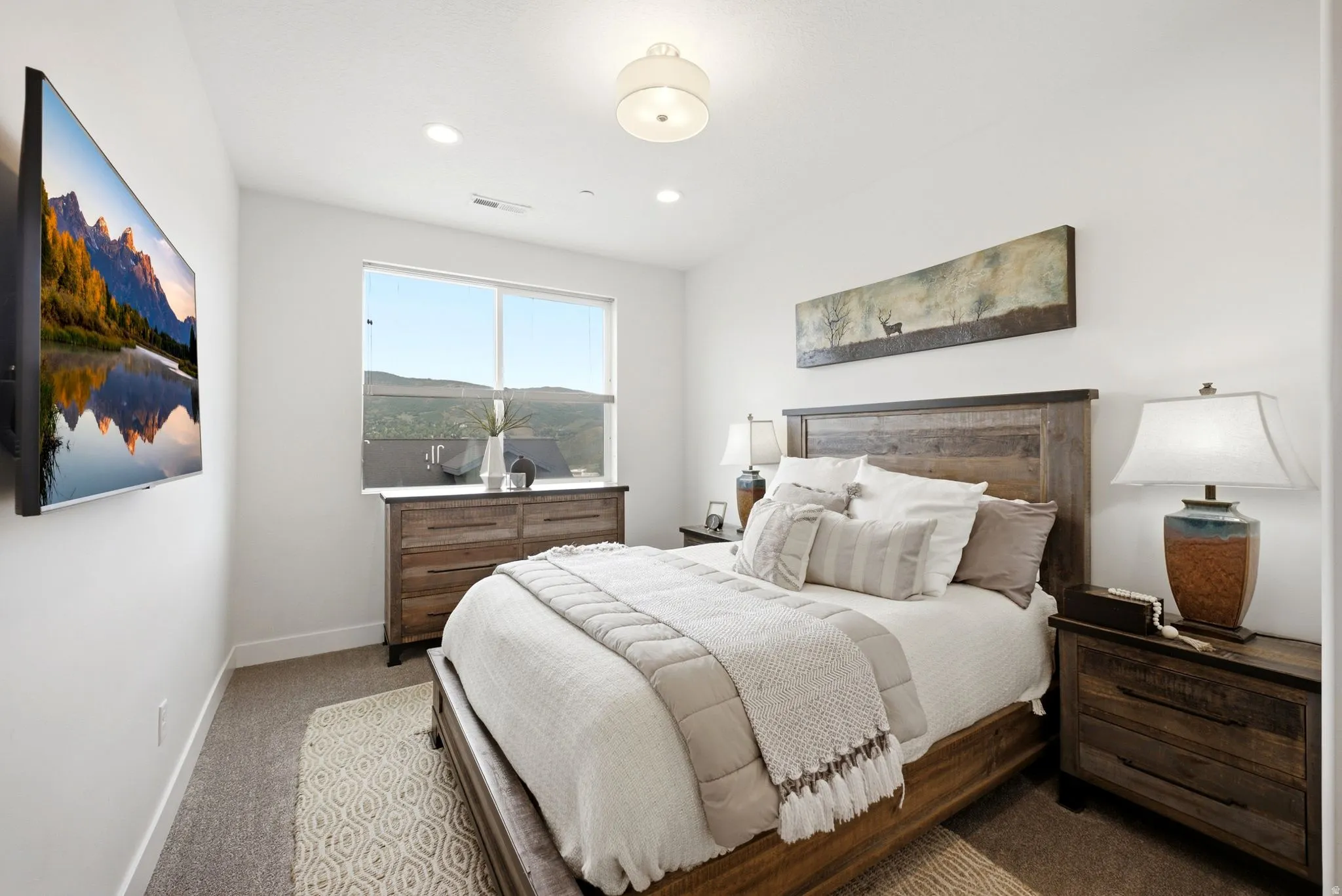 Bright room featuring a large window, recessed lighting, and a contemporary ceiling fixture