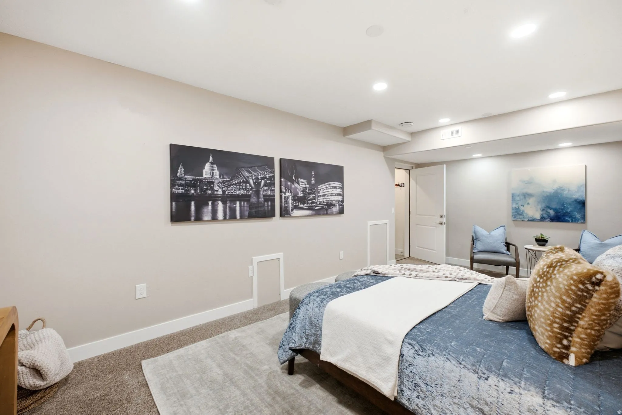 Carpeted room with recessed lighting and neutral wall tones