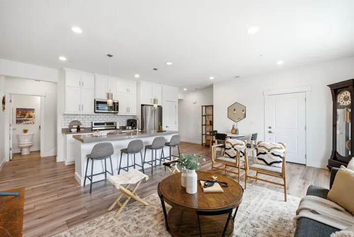 Open-concept living space featuring wood-finish flooring throughout