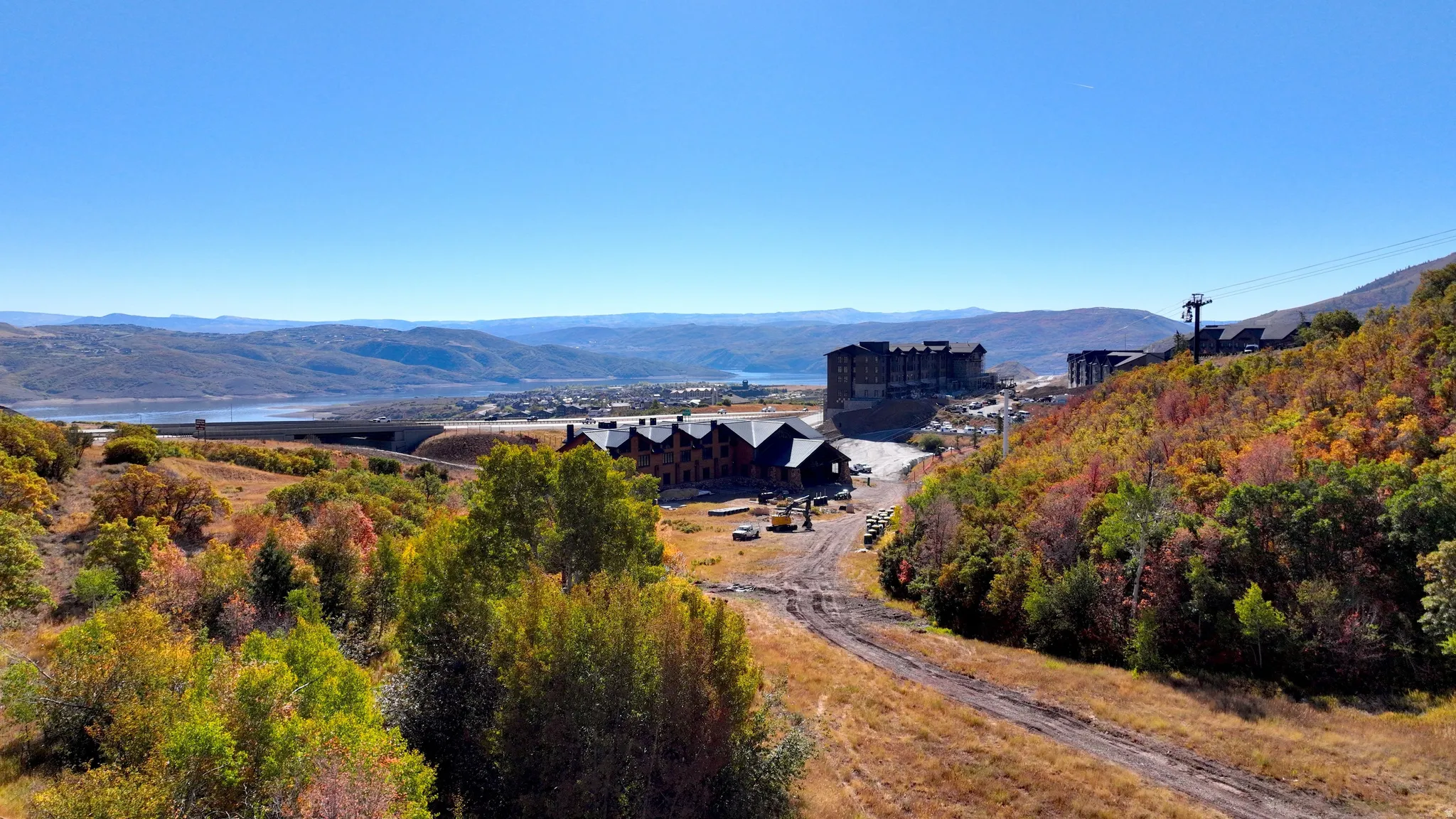 Panoramic mountain landscape with a distant lake