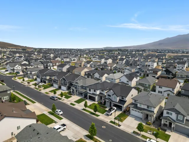 Expansive residential community featuring a variety of architectural styles, paved streets, and landscaped lots