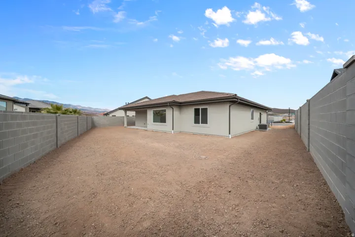 Expansive backyard space with perimeter block fencing
