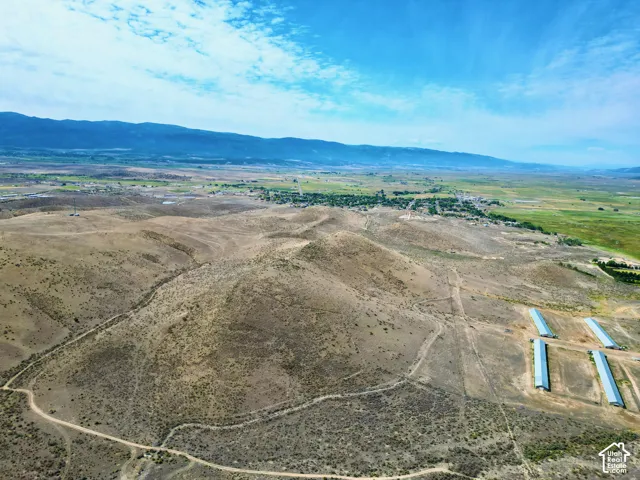 Expansive acreage featuring rolling hills, varied terrain, and distant mountain ranges