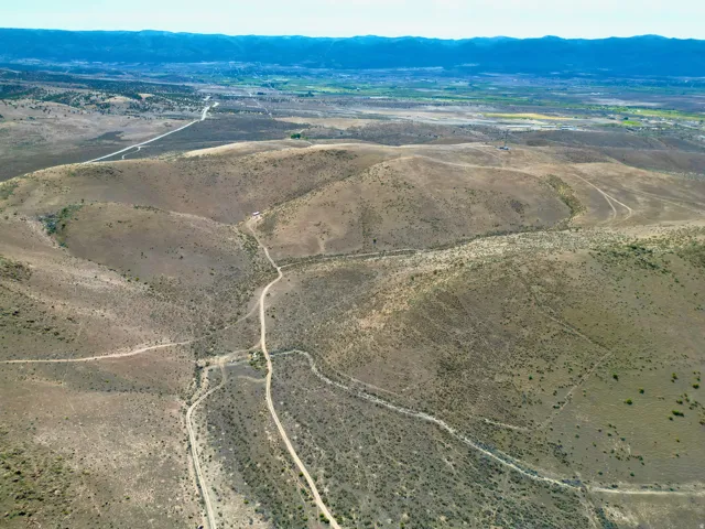 Expansive acreage featuring rolling hills and natural desert vegetation