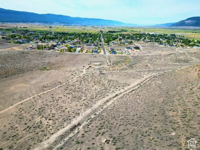 Expansive undeveloped land with visible dirt paths
