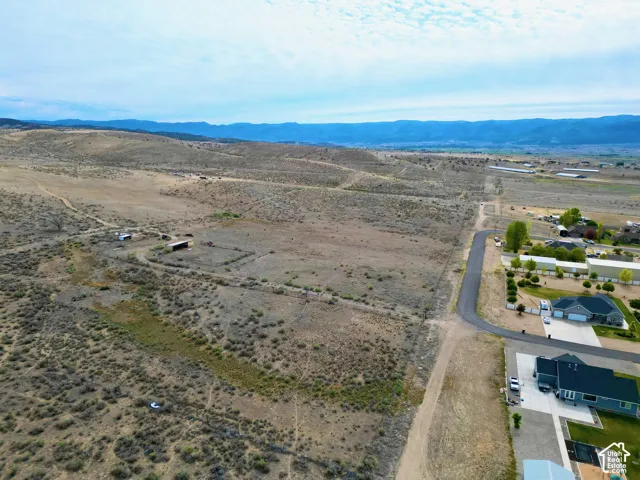 Expansive rural acreage featuring distant mountain ranges and scattered brush