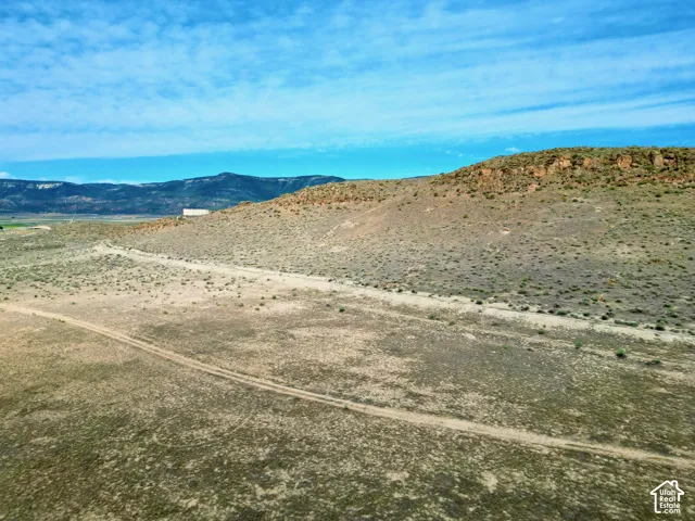 Expansive undeveloped landscape featuring a gently sloping terrain