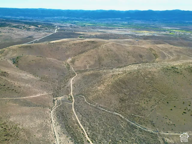 Expansive acreage featuring rolling hills and natural desert vegetation