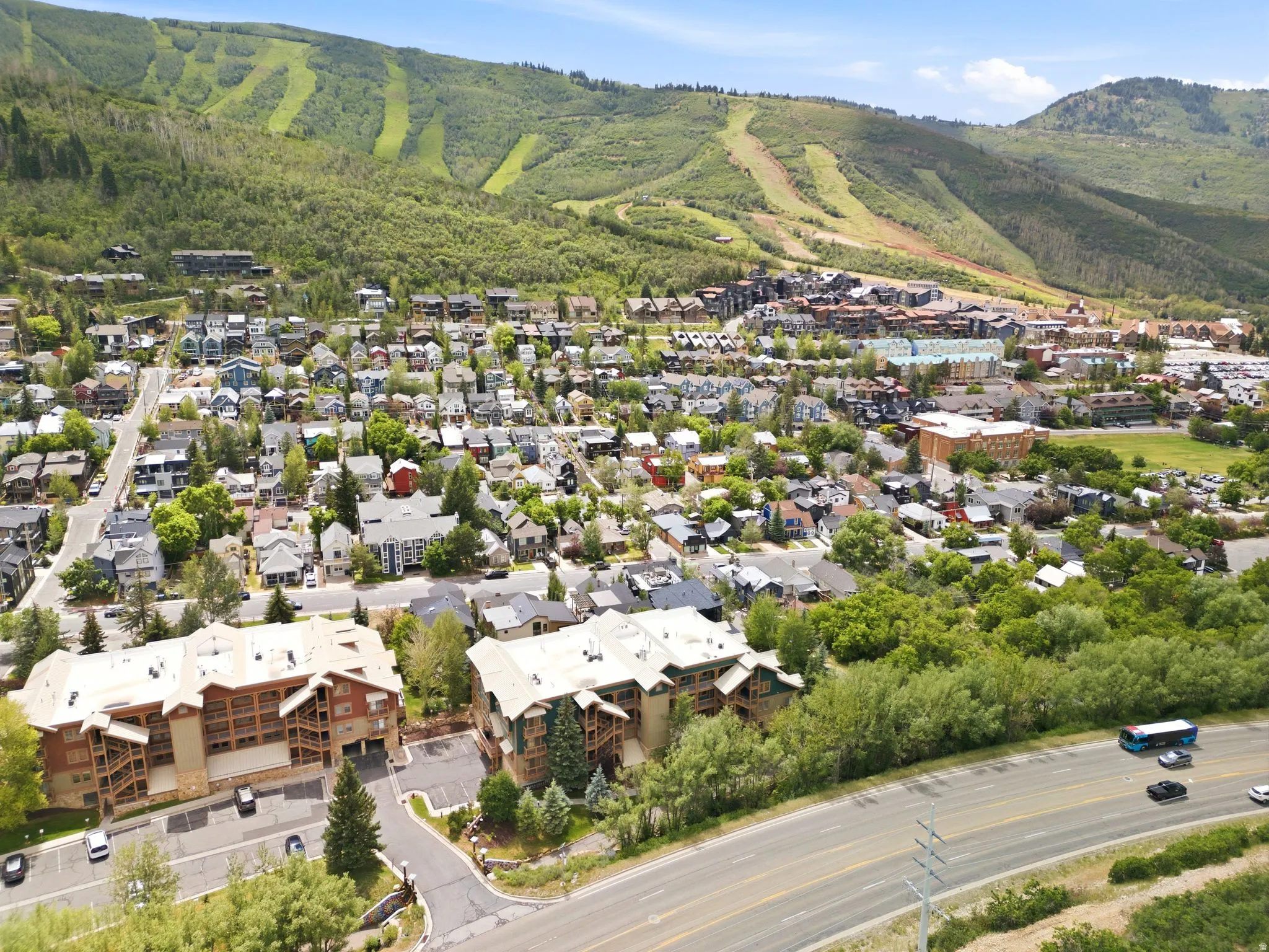 Expansive mountain landscape featuring varied terrain and lush greenery