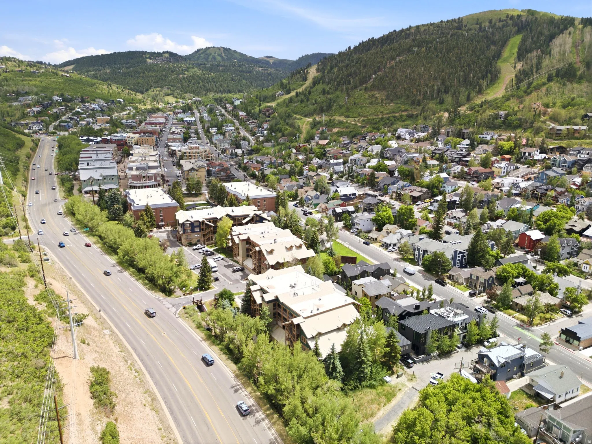 Aerial perspective showcasing a vibrant mountain town with diverse architectural styles