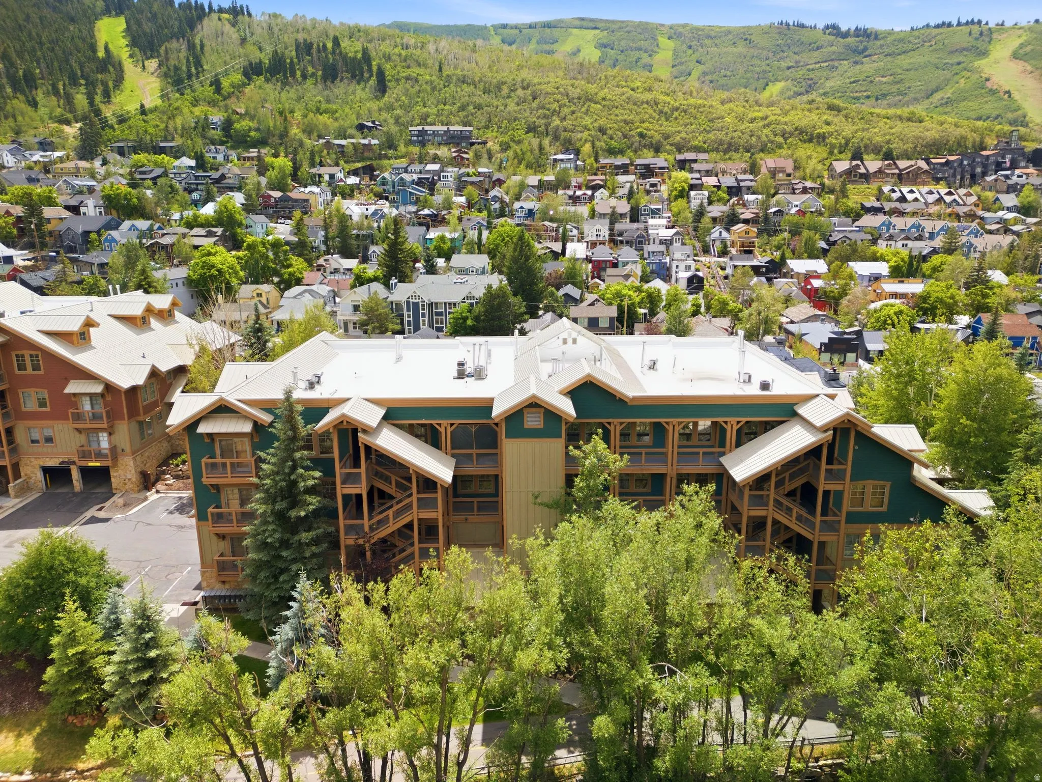 Multi-story building featuring extensive wood balconies and exterior stairs