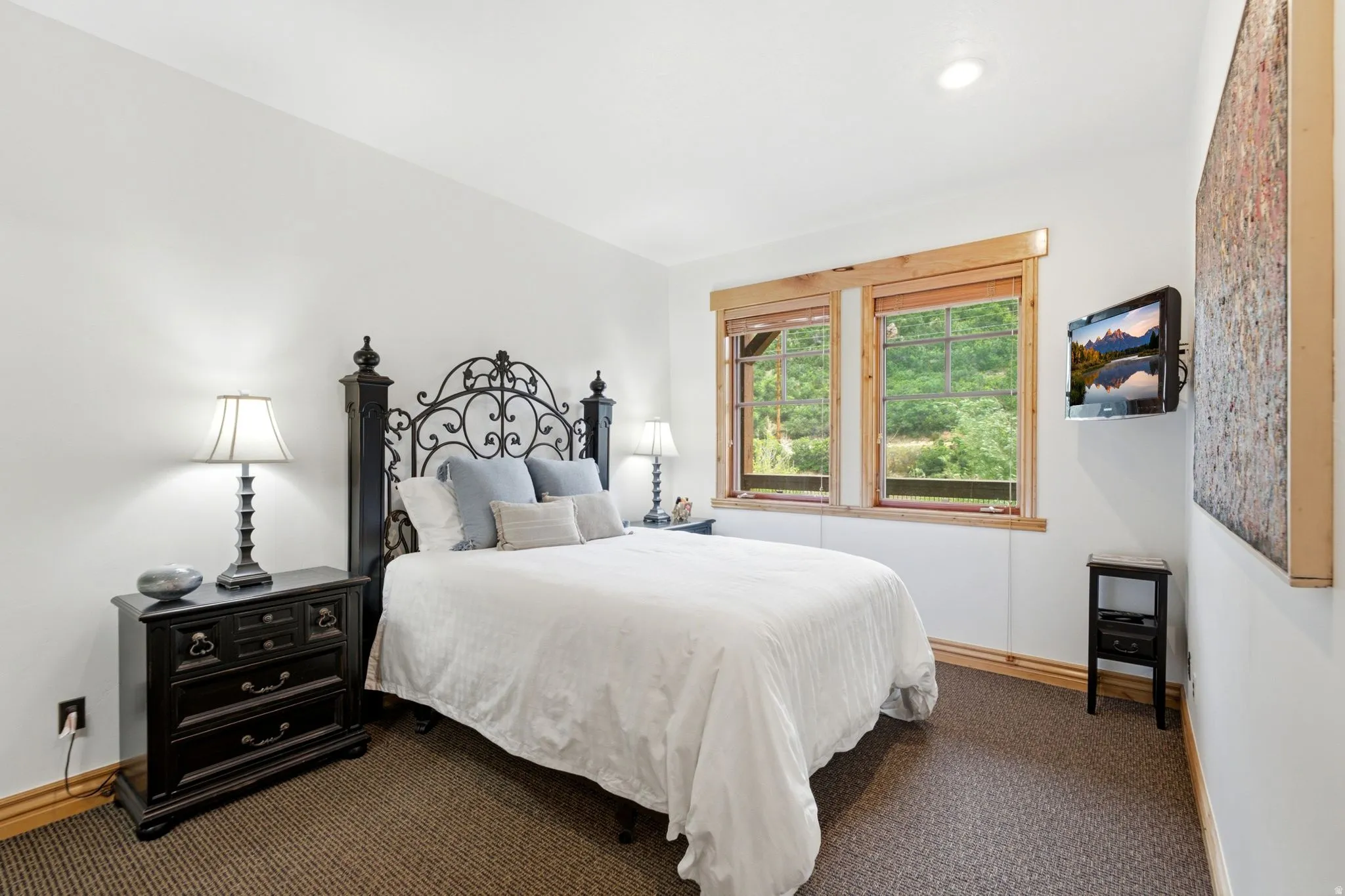 Bedroom with recessed lighting, carpet flooring, and wood trim
