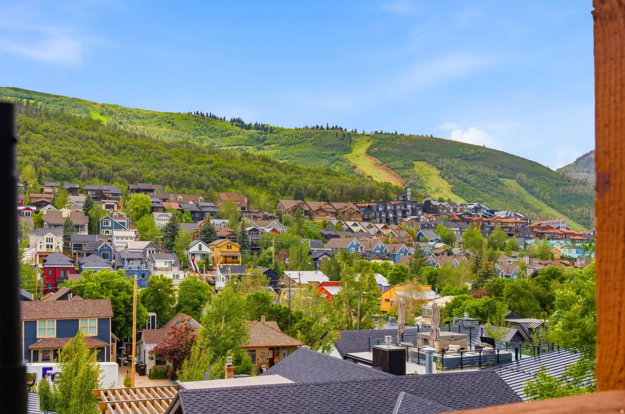 Expansive mountain scenery featuring a residential landscape