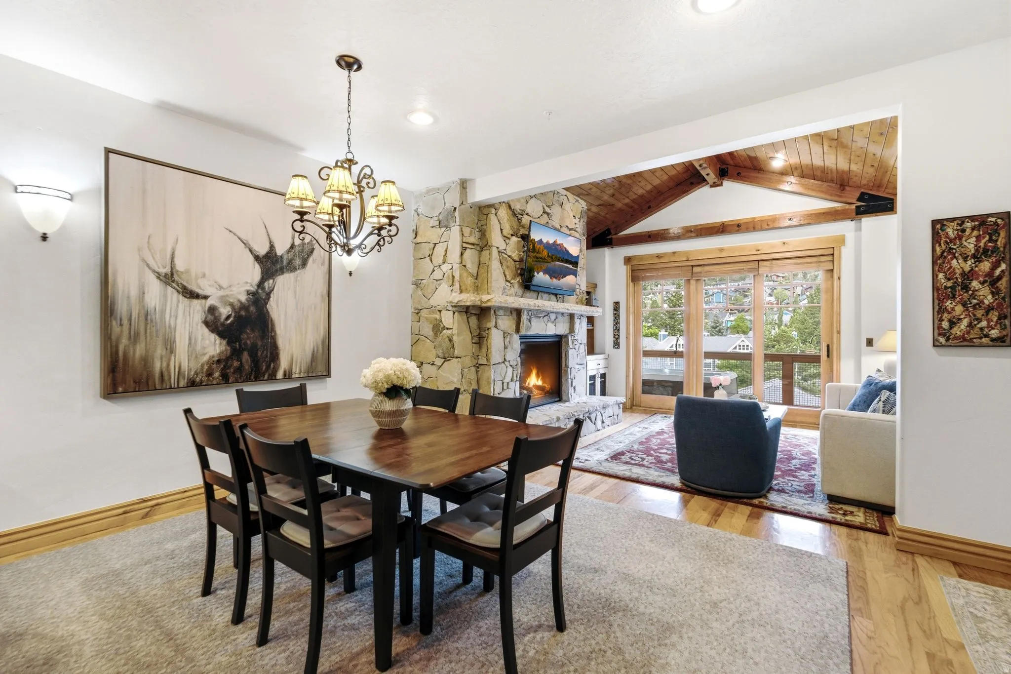 Dining area featuring a decorative chandelier and sconce lighting
