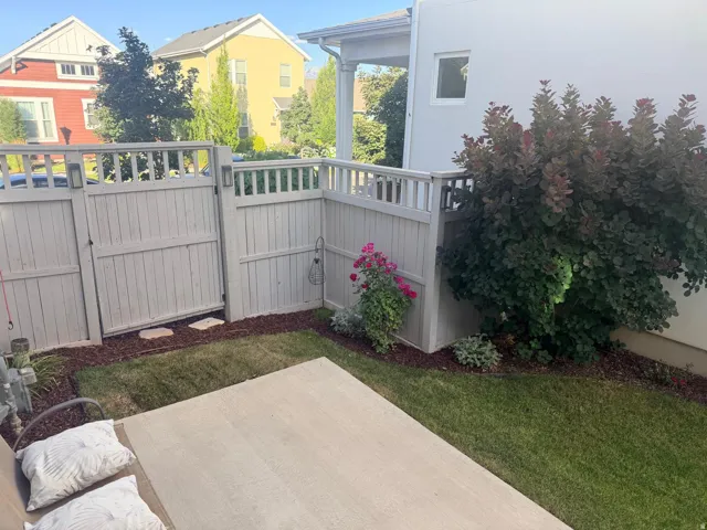 Private patio space featuring a concrete slab and a fenced perimeter