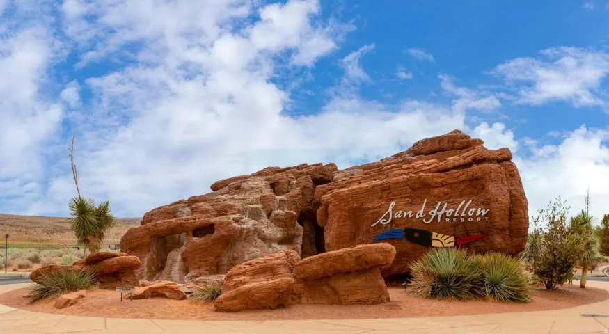 Sand Hollow Resort entrance signage crafted from natural red rock formations, featuring integrated resort branding