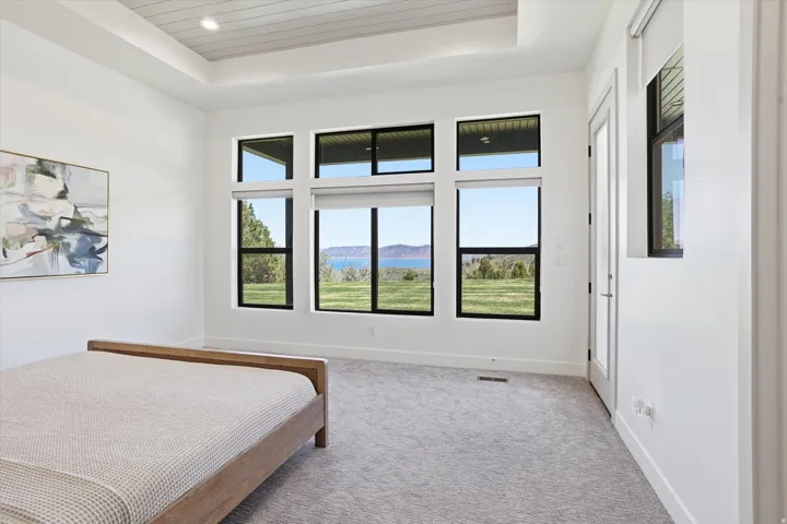 Expansive windows featuring scenic mountain and water vistas
