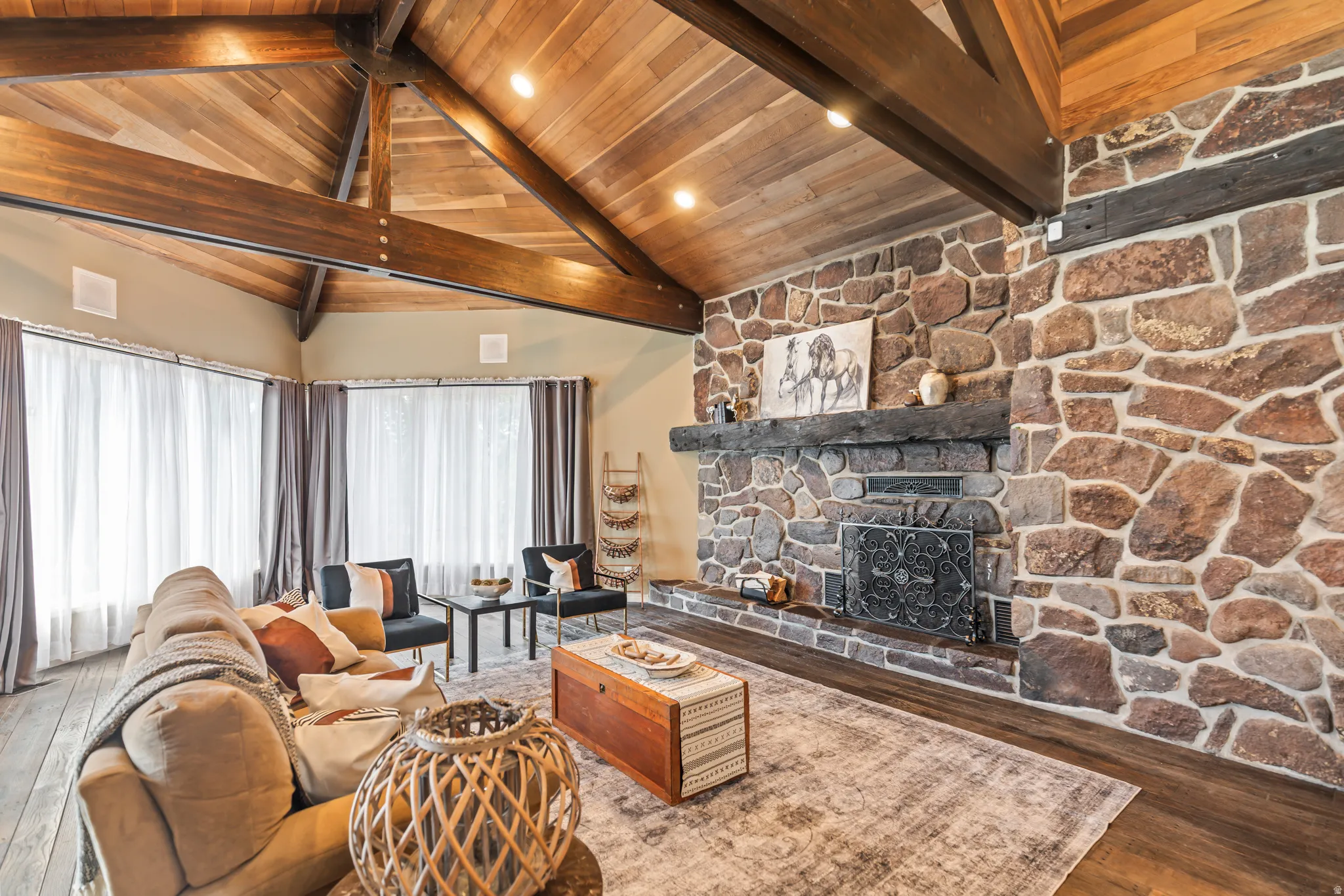 Vaulted wood-paneled ceiling with exposed beams and recessed lighting