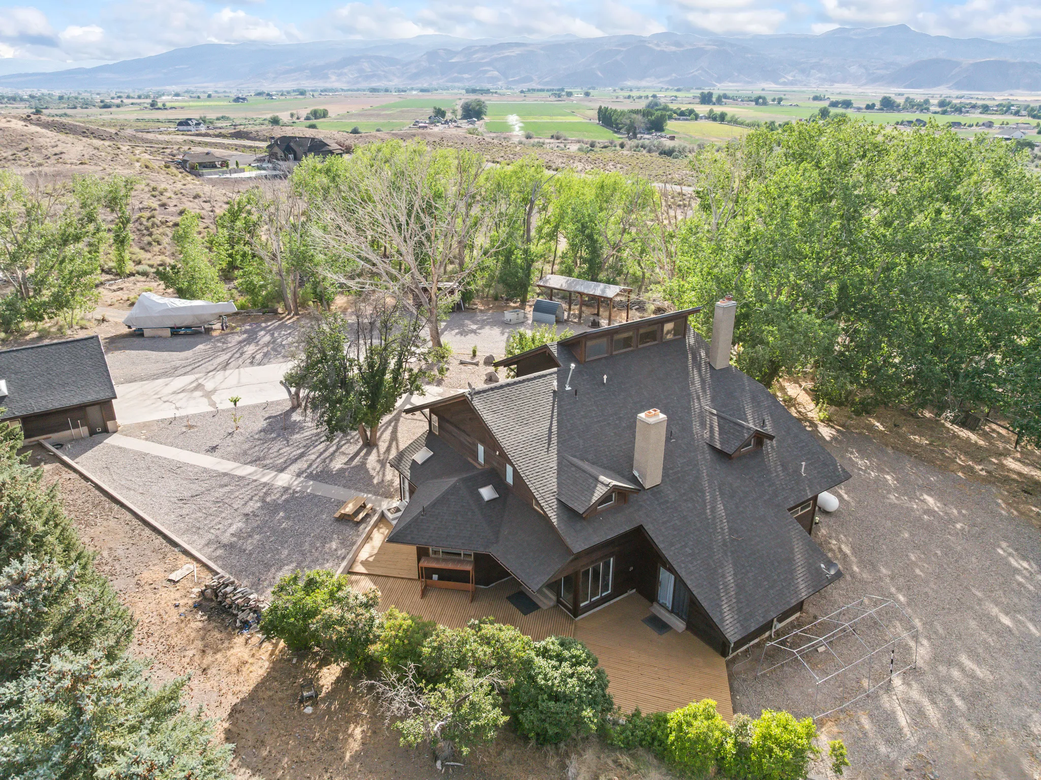 Custom-designed residence featuring a multi-gabled roofline and multiple chimneys