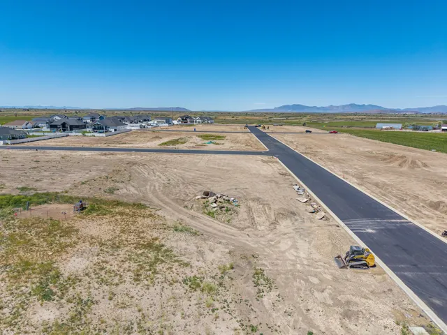 Expansive land parcels featuring newly paved roads and clear lot demarcation