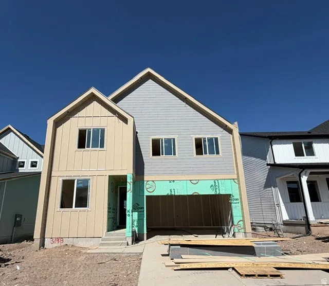 New construction residence featuring a two-story design with a prominent front-facing gable