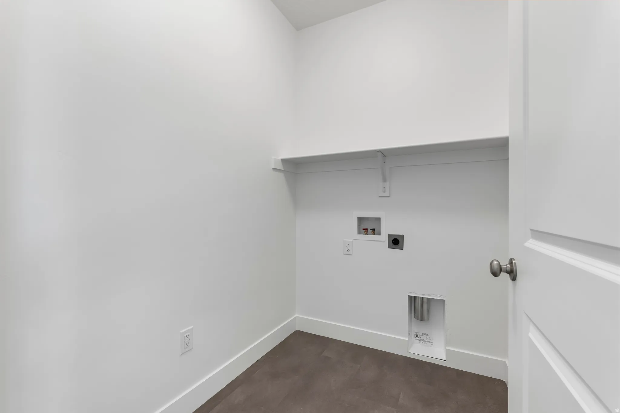 Dedicated utility space featuring a neutral color palette