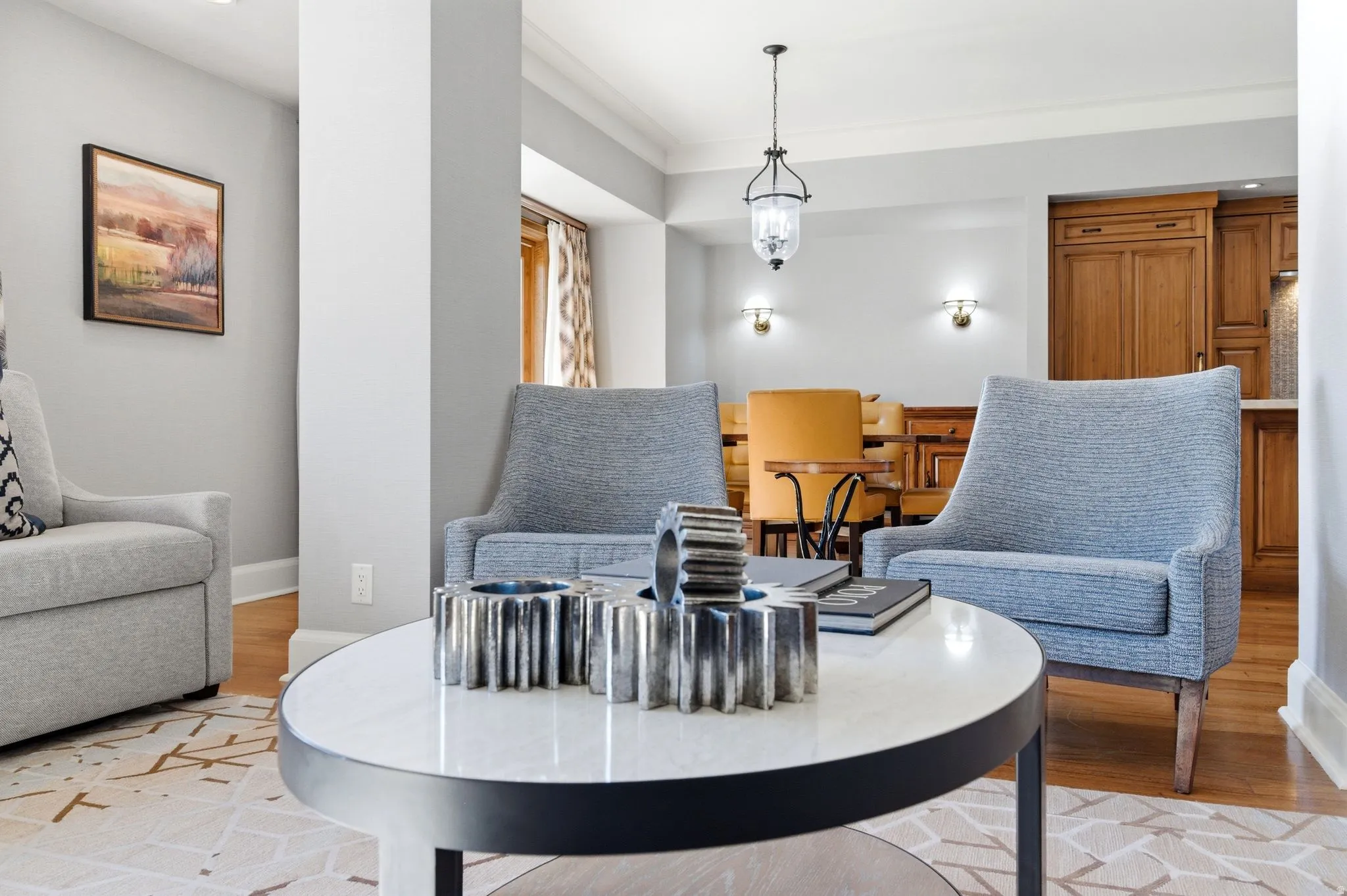 Living area featuring hardwood flooring, recessed lighting, and crown molding